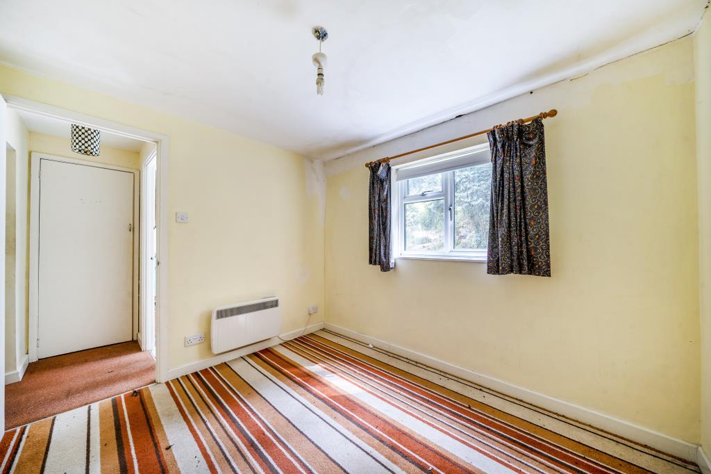 Lot: 156 - END-TERRACE COTTAGE FOR IMPROVEMENT - Bedroom with striped carpet